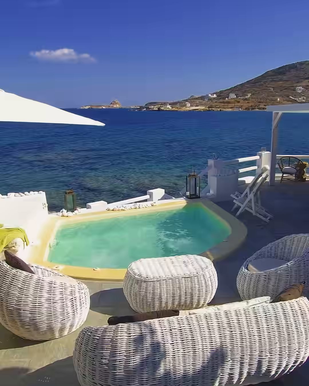 A plunge-pool terrace above the sea
